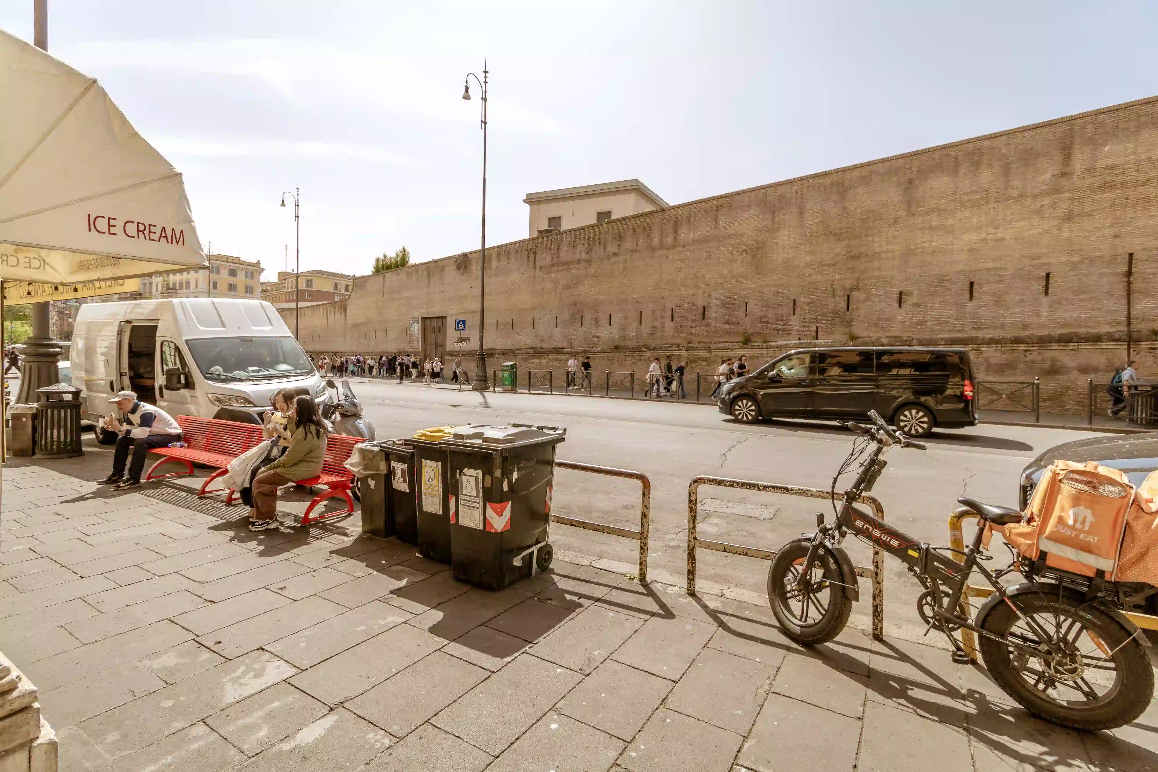 Lively street scene at the foot of the ancient city walls, just steps from the property