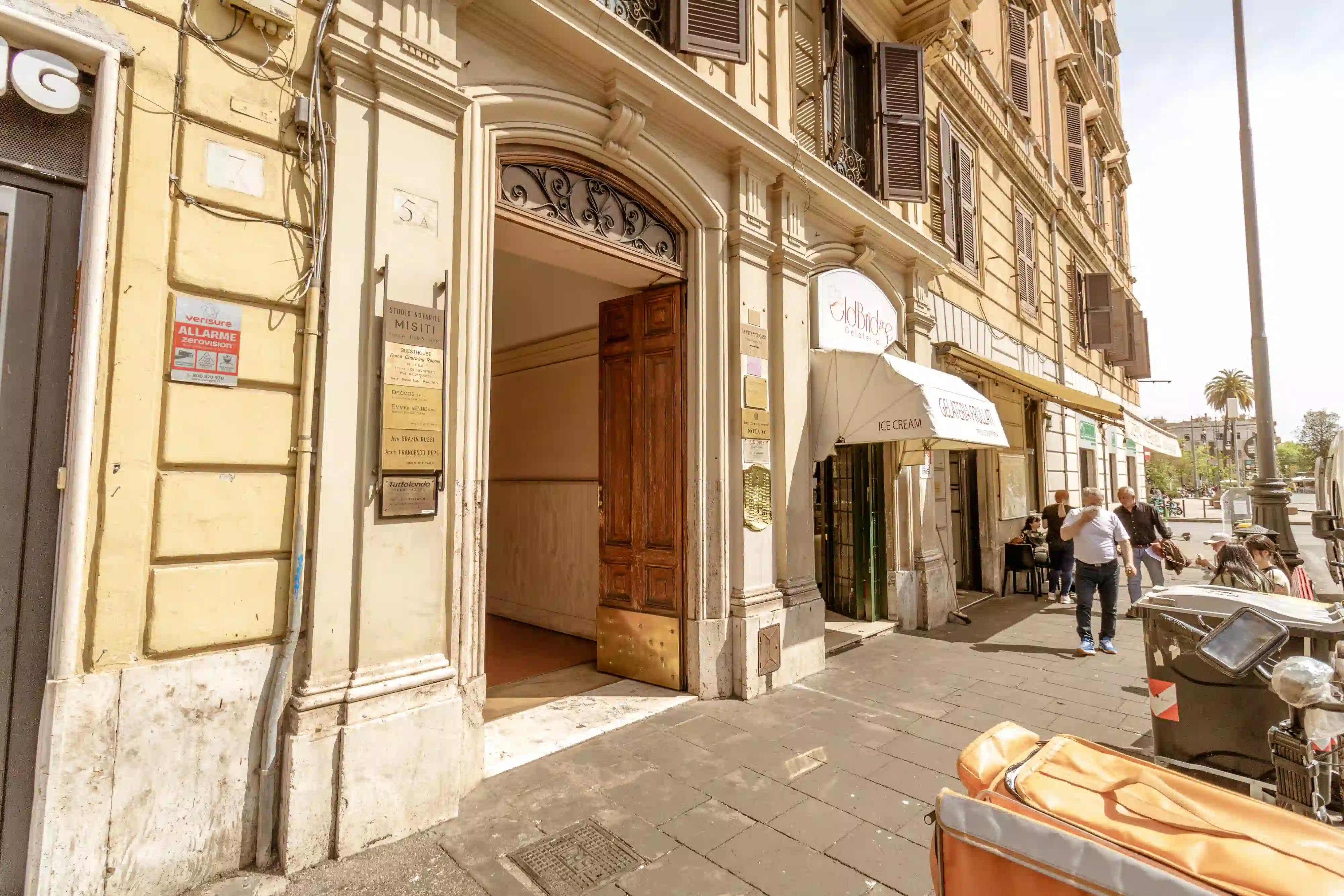 Grand building entrance with ornate portal on the main street