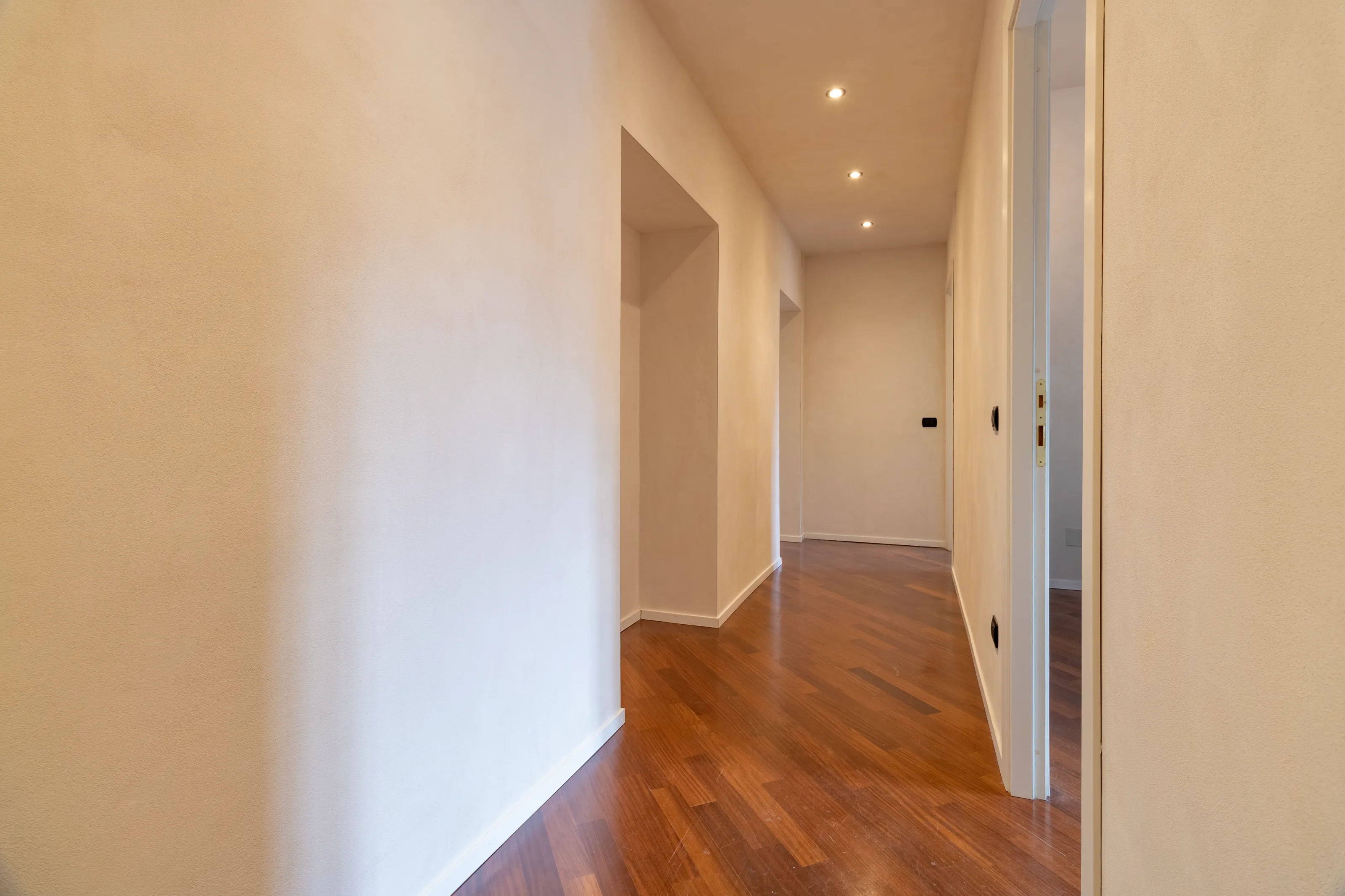 Spacious hallway with wooden flooring