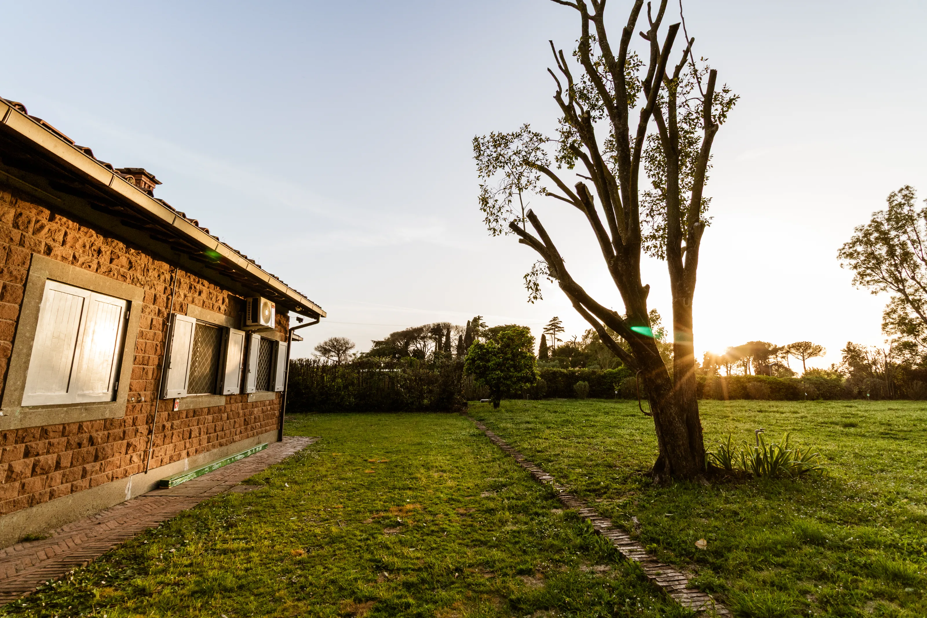 Large garden with open view and stunning sunset