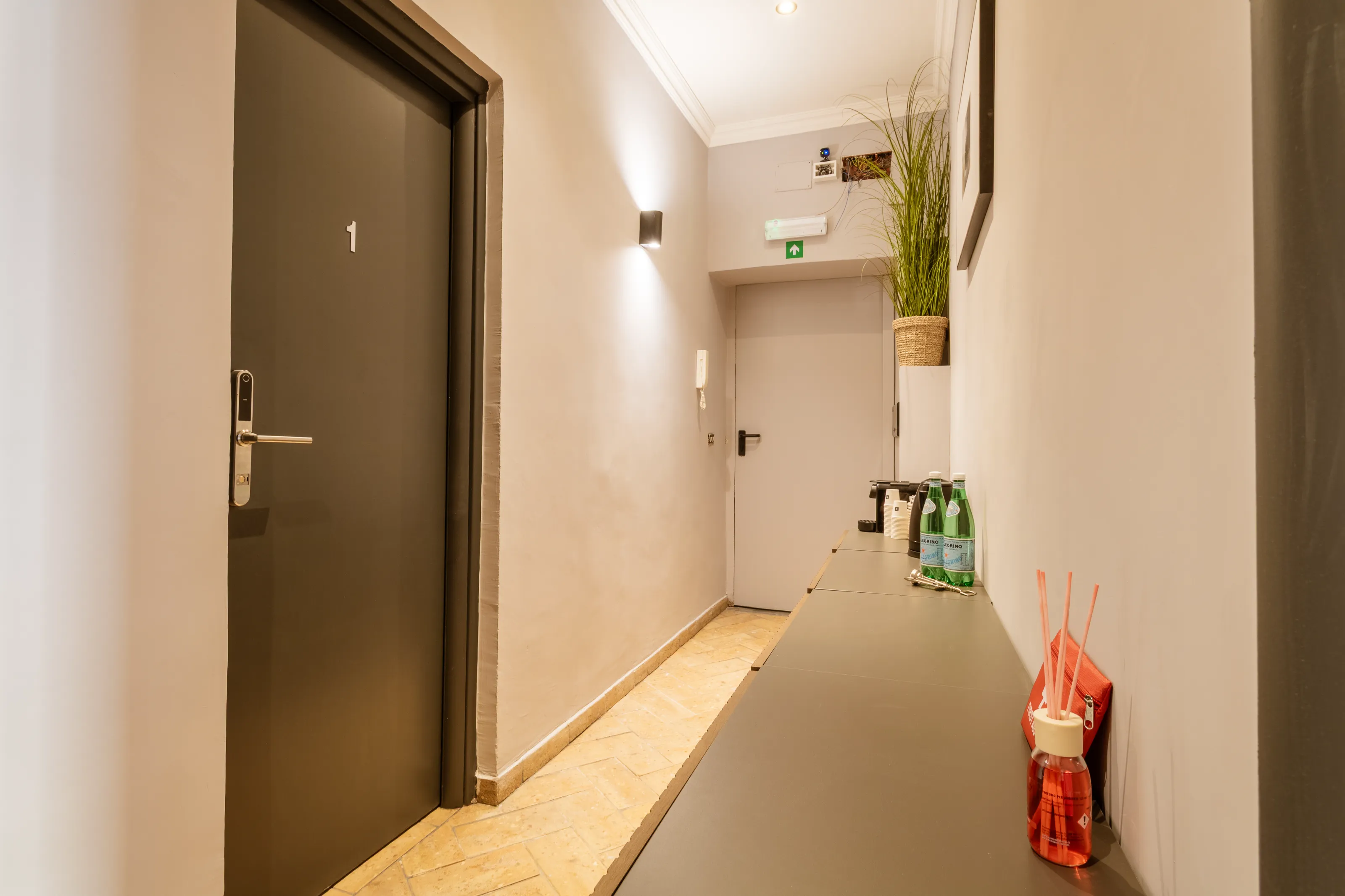 A welcoming hallway with coffee and water station for guests’ convenience