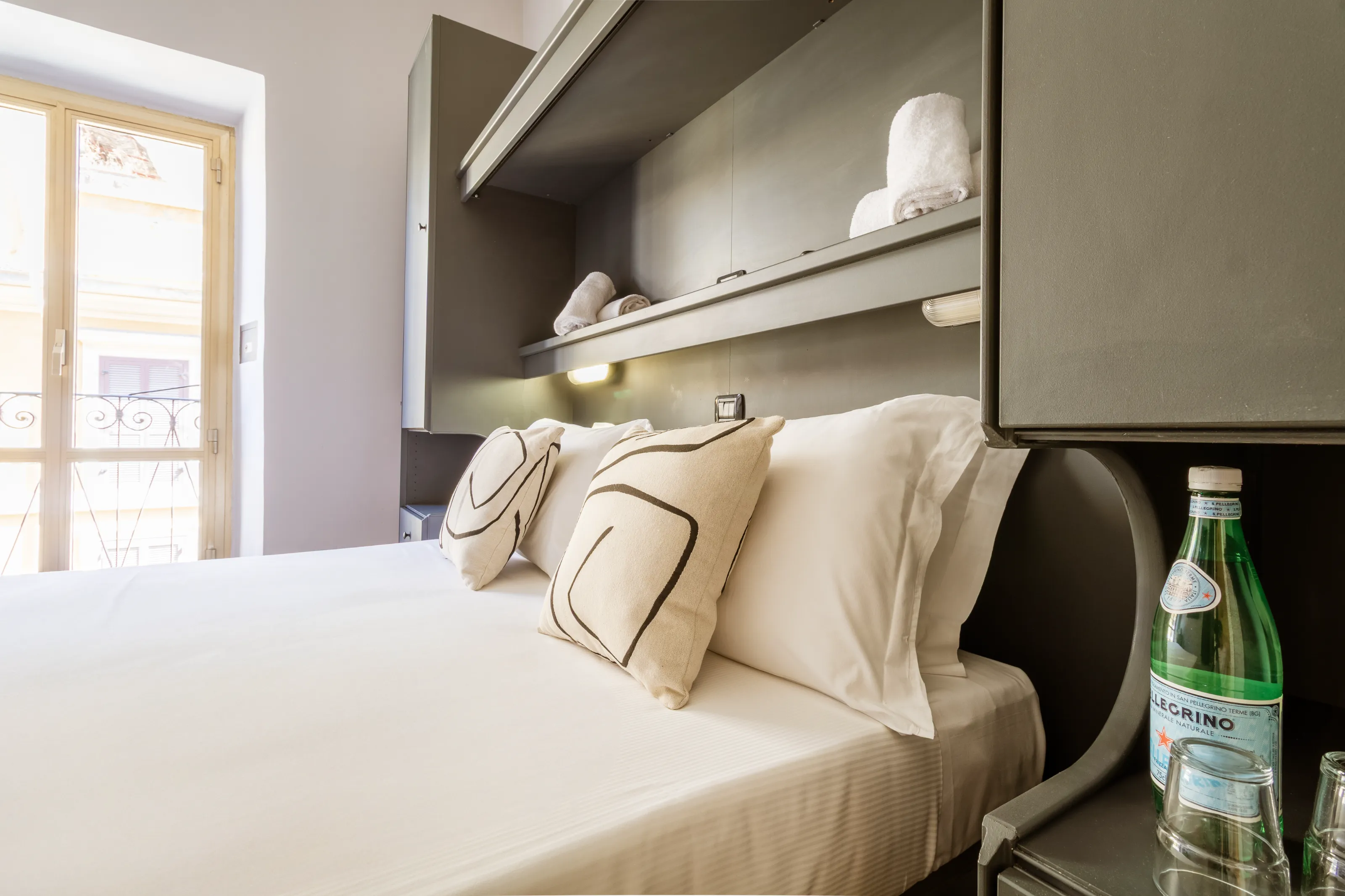 Bright bedroom with minimalist décor and large windows for natural light